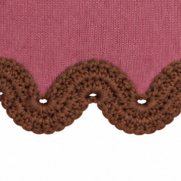 Detail of the Eleonora jumper featuring intricate hazel brown hand-crocheted baby alpaca scalloped lace along the dusty rose merino hem.