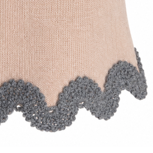 Close-up of the Gabriella BAROQUE skirt's scalloped Grey Baby Alpaca crochet edging, highlighting the intricate handmade stitches and soft texture against the Beige Merino knit.