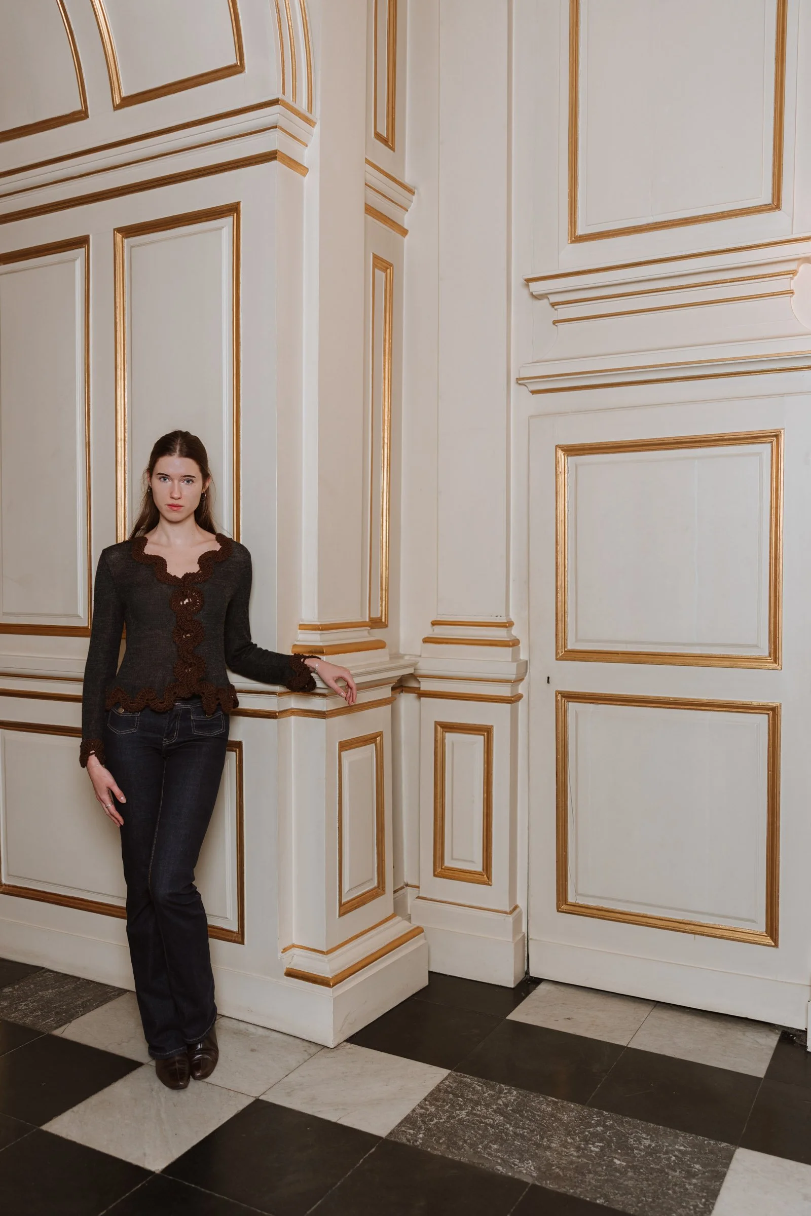 Studio Myr BAROQUE – Francisca Merino wool jacket with hand-crocheted lace, casually styled with dark jeans for effortless elegance