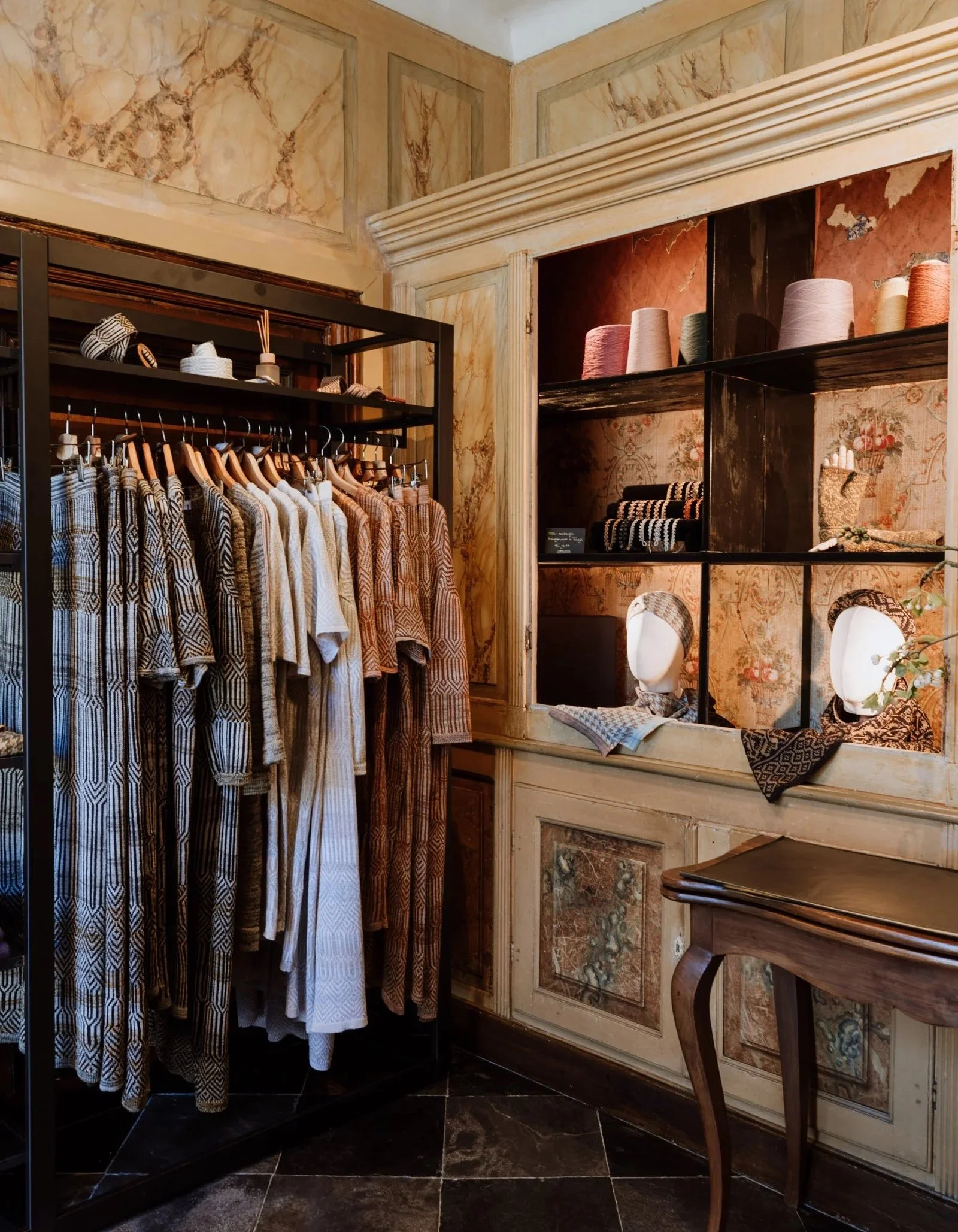 Interior of the Studio Myr boutique in Thorn, displaying knitwear pieces and accessories in a calm, intimate setting.