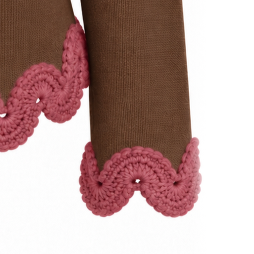 Close-up of the Eleonora Jacket sleeve in Hazel Brown Extra Fine Merino wool, finished with a sculptural Dusty Rose hand-crocheted Baby Alpaca lace cuff.