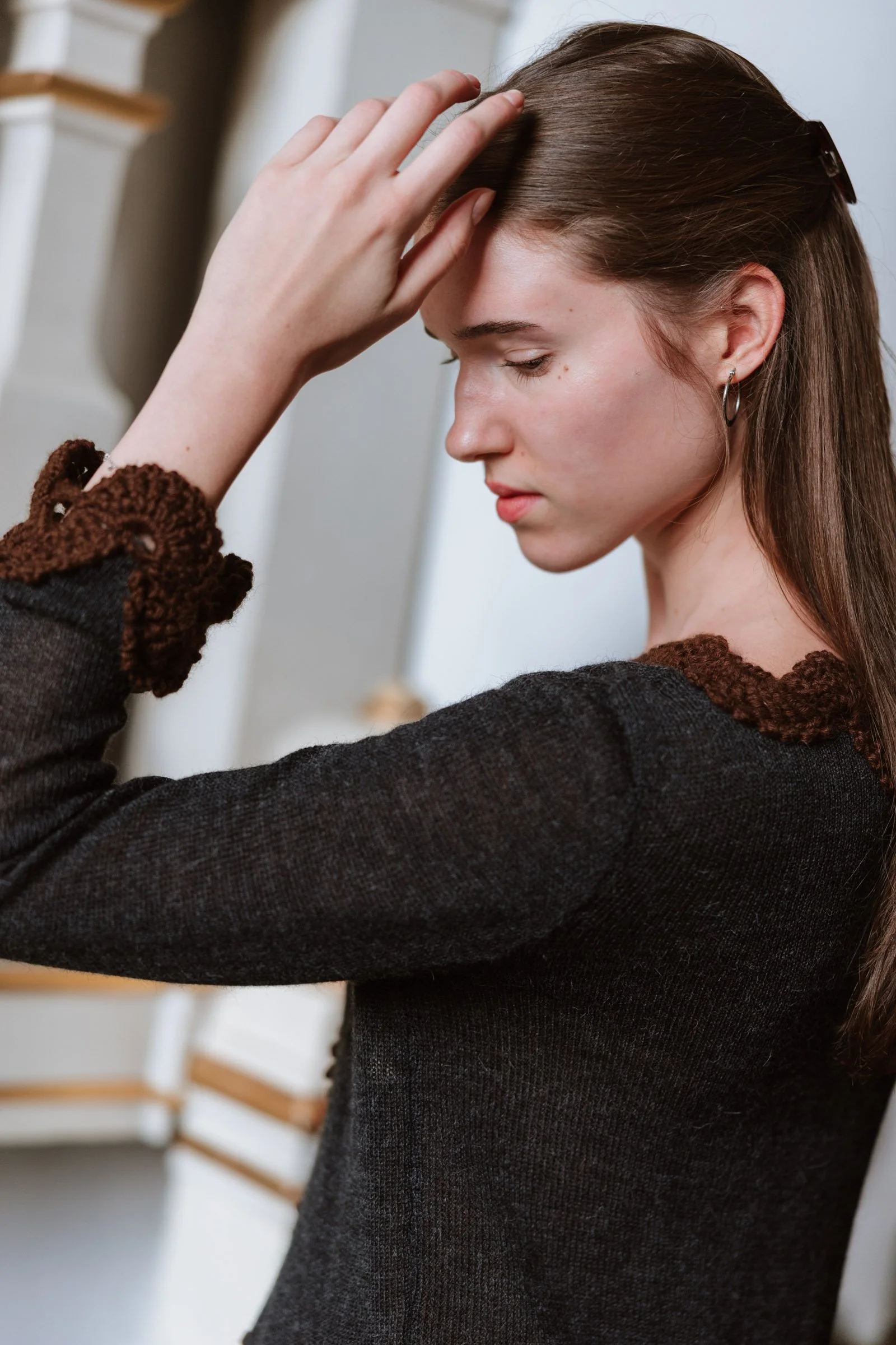 Studio Myr BAROQUE – Model wearing the Francisca jacket, highlighting the chocolate brown hand-crocheted Baby Alpaca lace cuffs