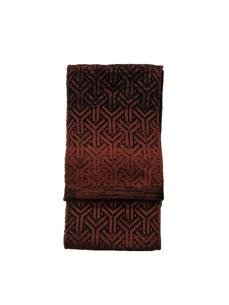 Folded Rust scarf from the Elements collection, featuring a refined graphic pattern in rust and black.png
