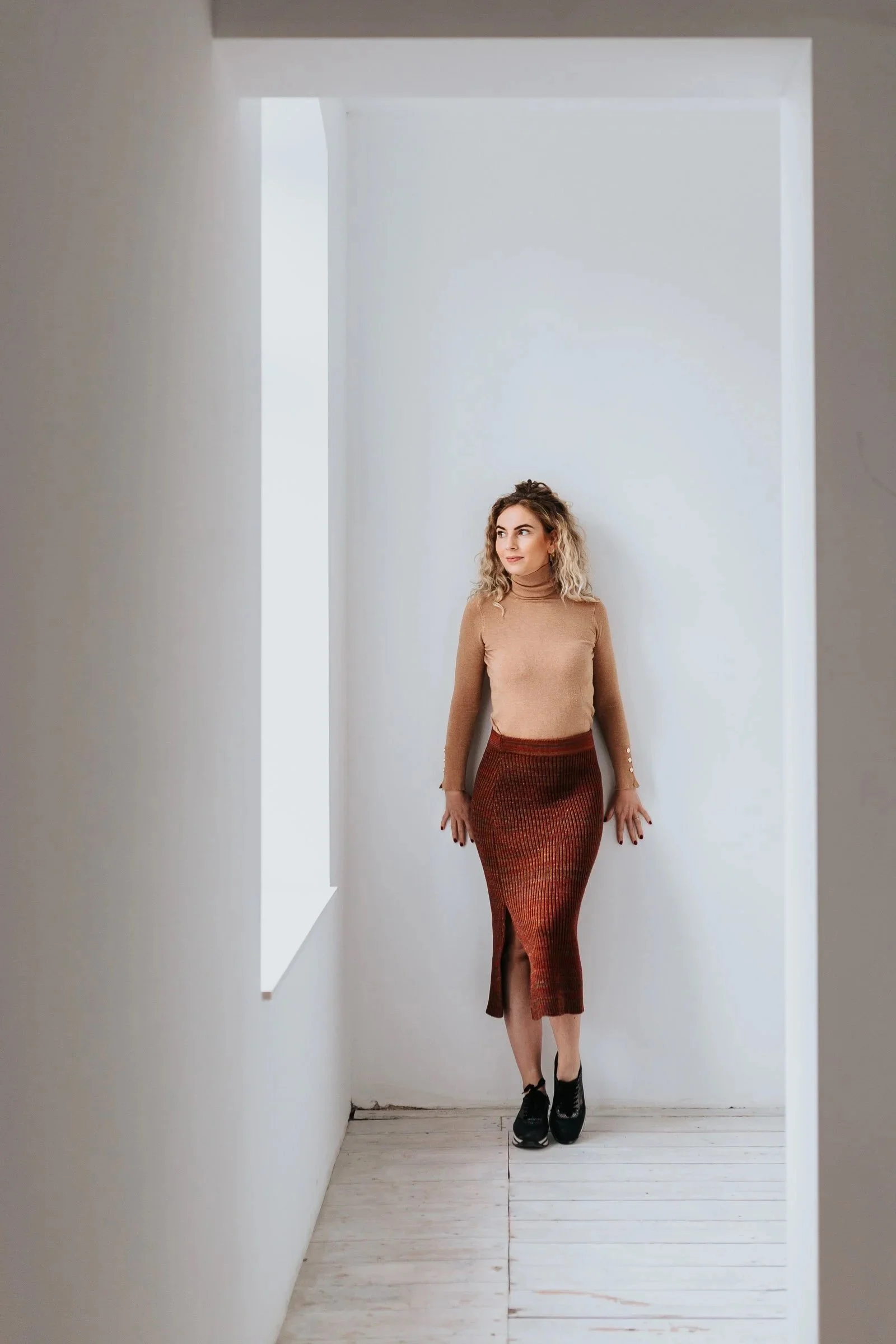 Rib knit midi pencil skirt with sparkles in rust brown Merino wool blend frontview model