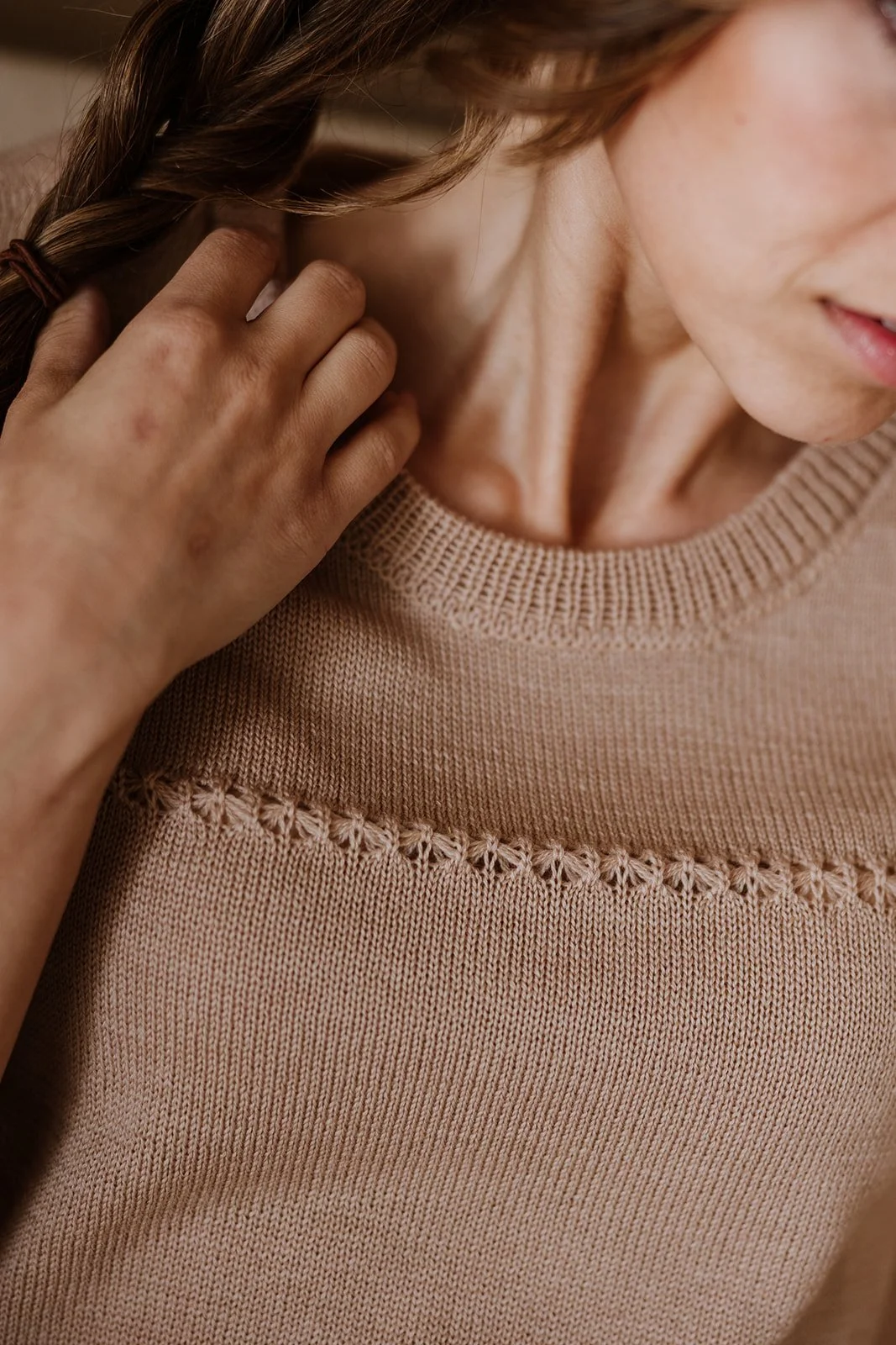 Detail of lace-knit structure and neckline on Studio Myr Merino Lace Knit Tee in Honey