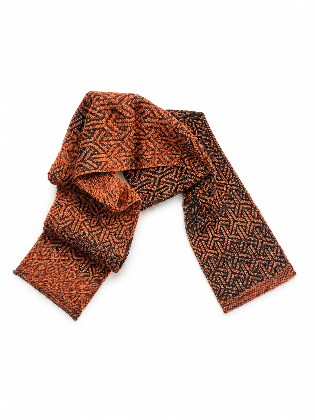 Rust scarf from the Elements collection, loosely draped in a graphic pattern of rust and black.png