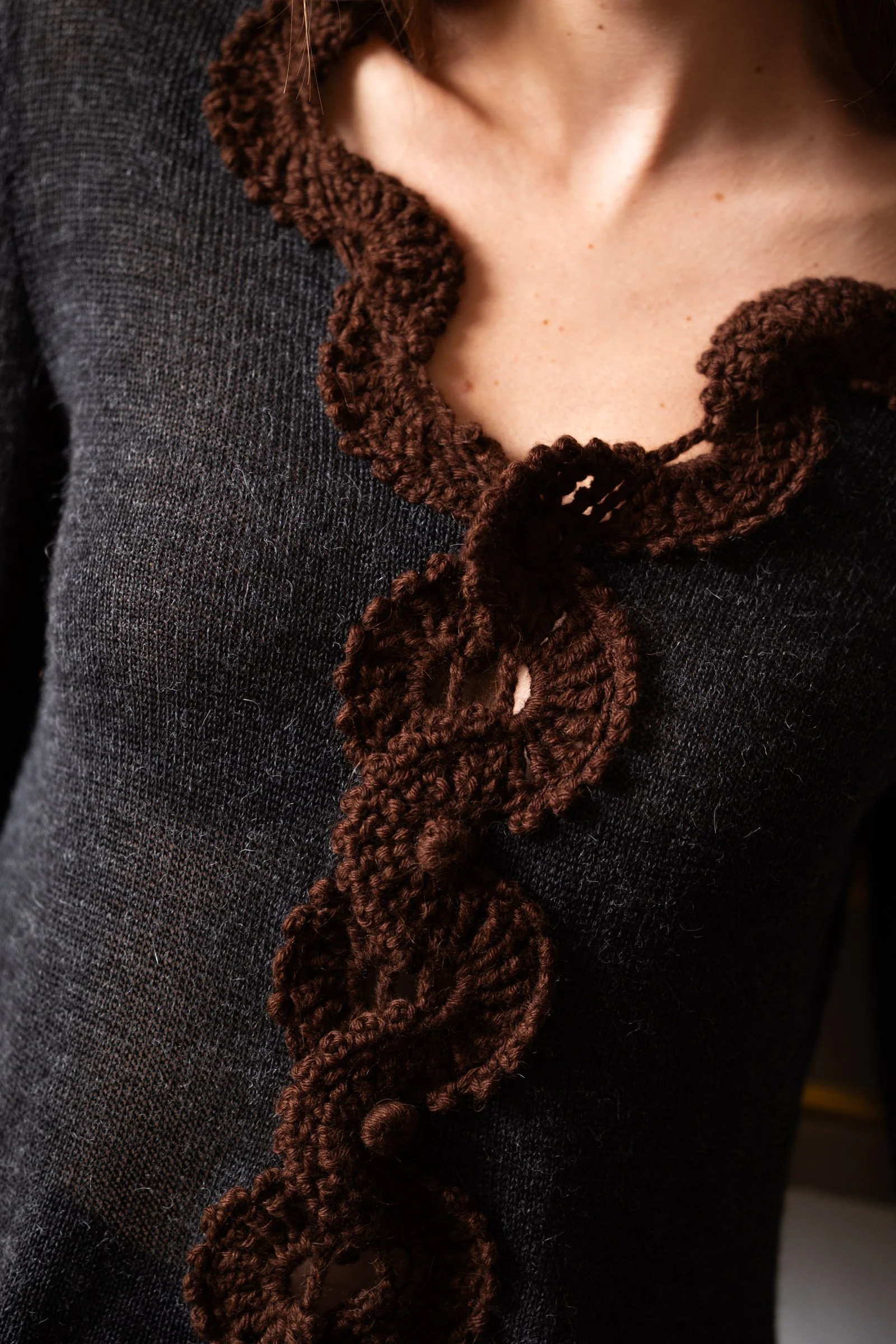 Studio Myr BAROQUE – Close-up of the Francisca jacket featuring handcrafted chocolate brown crochet lace and decorative crocheted buttons
