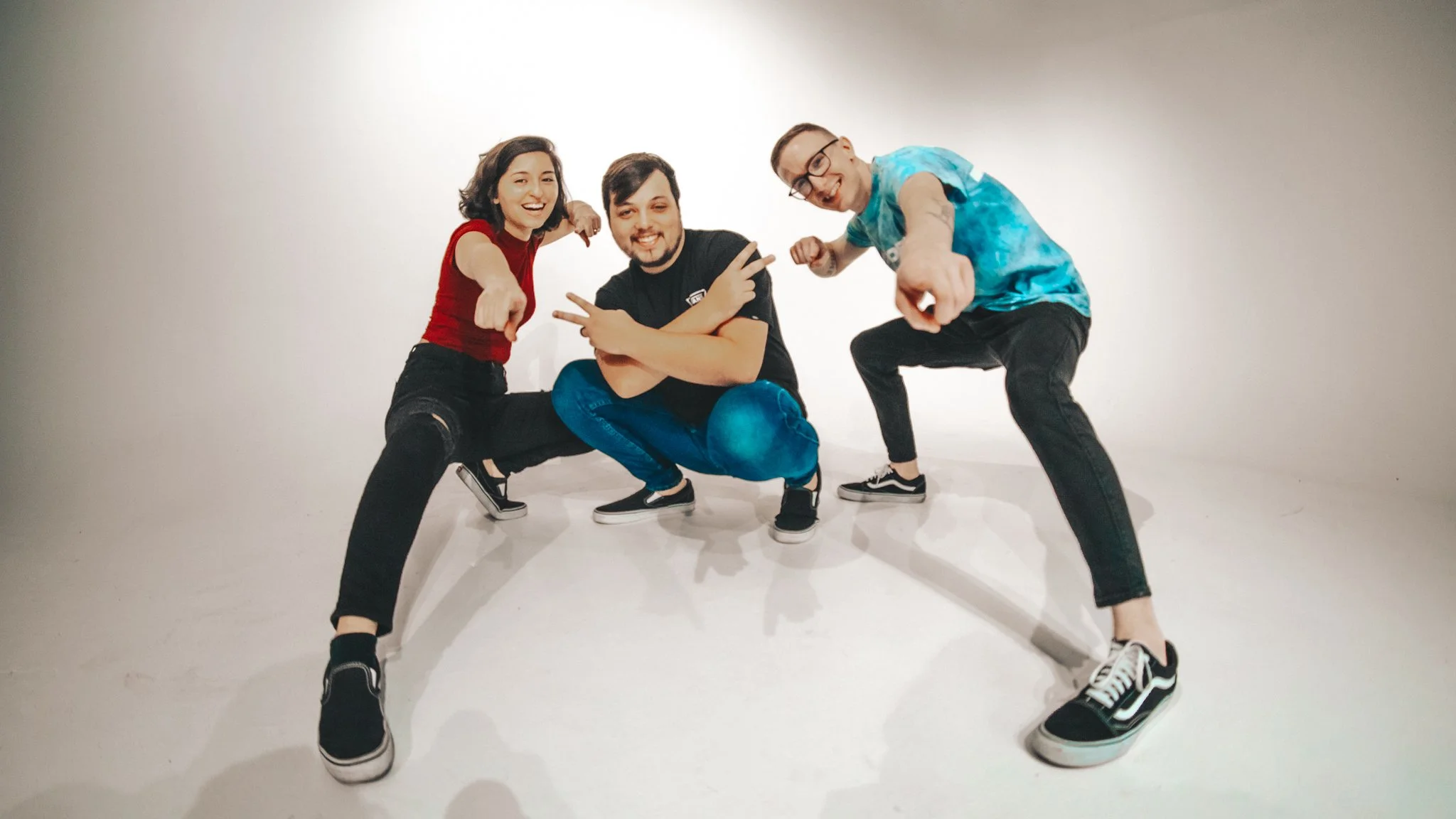 Promo photo of the band point at the camera