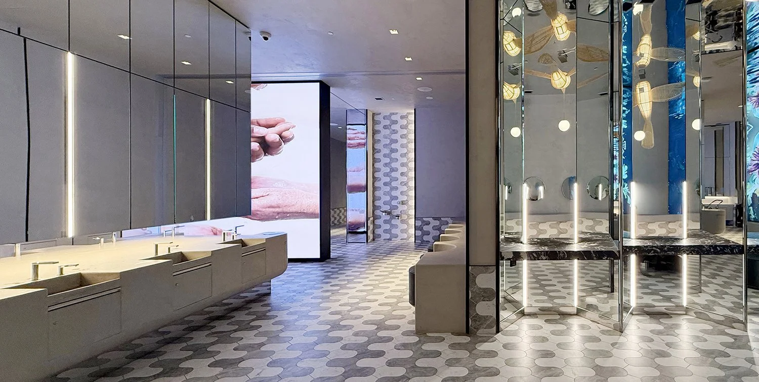 “Royalmount all-inclusive bathroom with integrated art installation”