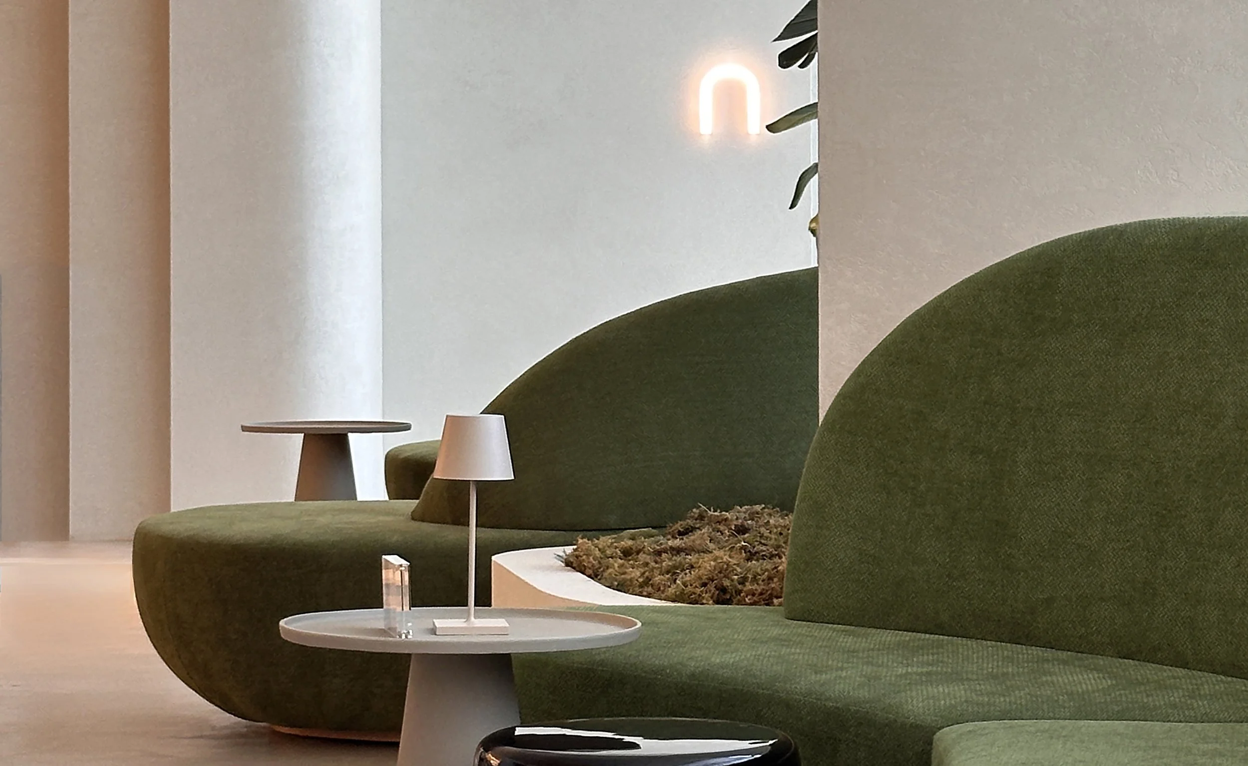 Rennai Curved green upholstered lounge seating with integrated planter
