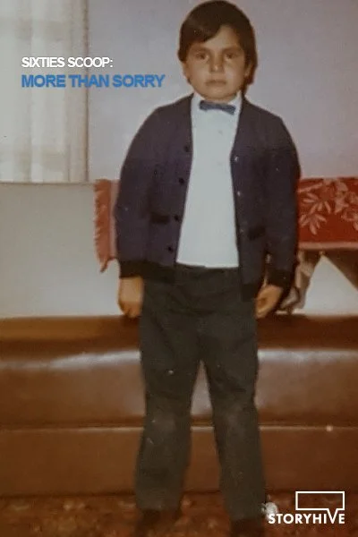 a young Indigenous boy standing in his living room