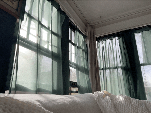 curtains moving gently in winter light at Longview Cottage
