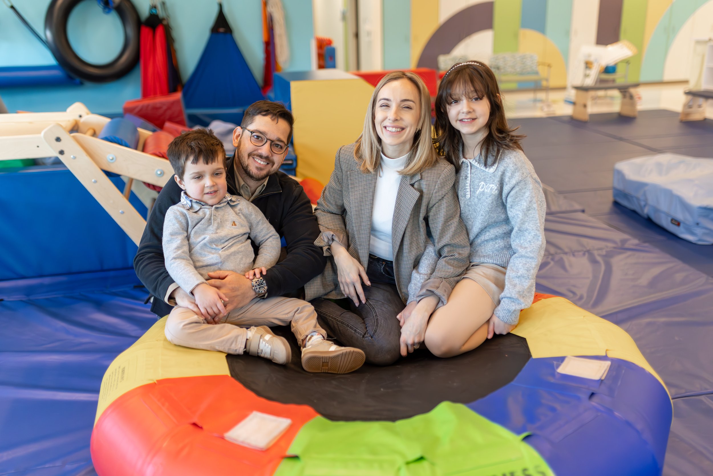 John Ryan with his mom, dad, and sister at Children's Specialized Hospital