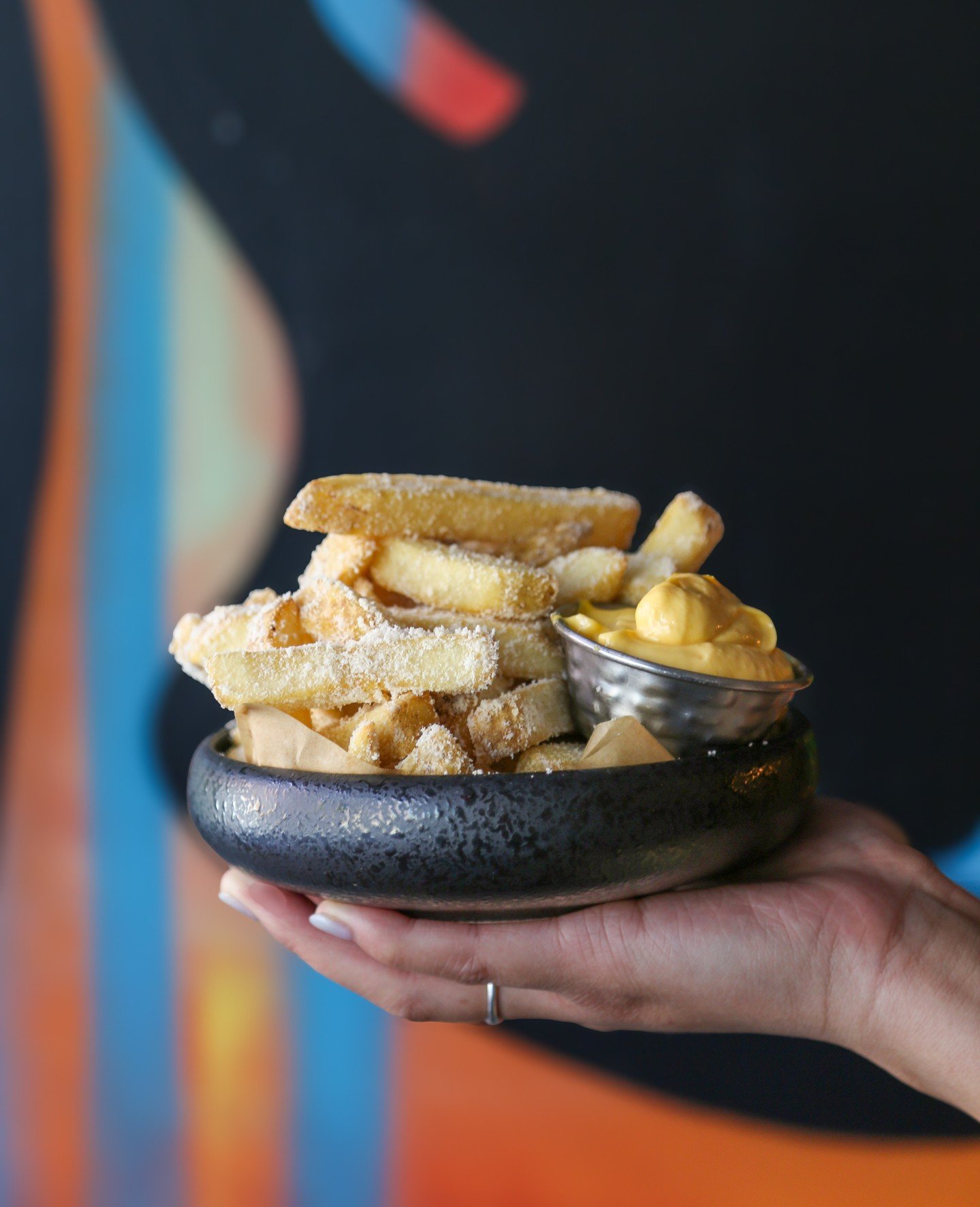 Thick-cut Filipino-style fries, hot from the fryer and blasted with vinegar powder. These golden potato wedges bring that classic, bold, deeply savory Pinoy sharpness to every bite. A must-order brunch side at Naks, East Village. Lasa mo, 'di ba? 😝