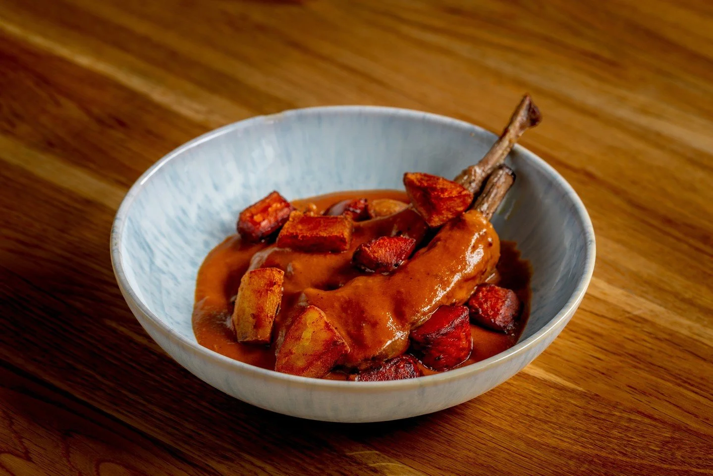 Caldereta, a Filipino stew built for fiestas and Sunday tables, slow-cooked until the meat falls apart and the sauce clings with deep, rich flavor. ⁠
⁠
At Naks, we flip that tradition: lamb chops charred over charcoal, laid in a roasted tomato sauce,