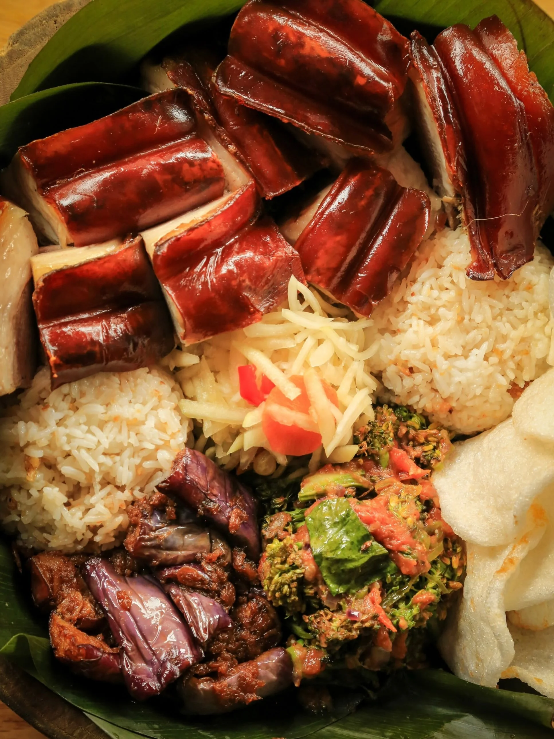 Our Lechon Platter brings together crispy pork belly with crackling skin, garlic rice, grilled and pickled vegetables, and all the little sides you&rsquo;ll want in every bite.

Built for sharing between two - though no promises you&rsquo;ll want to.