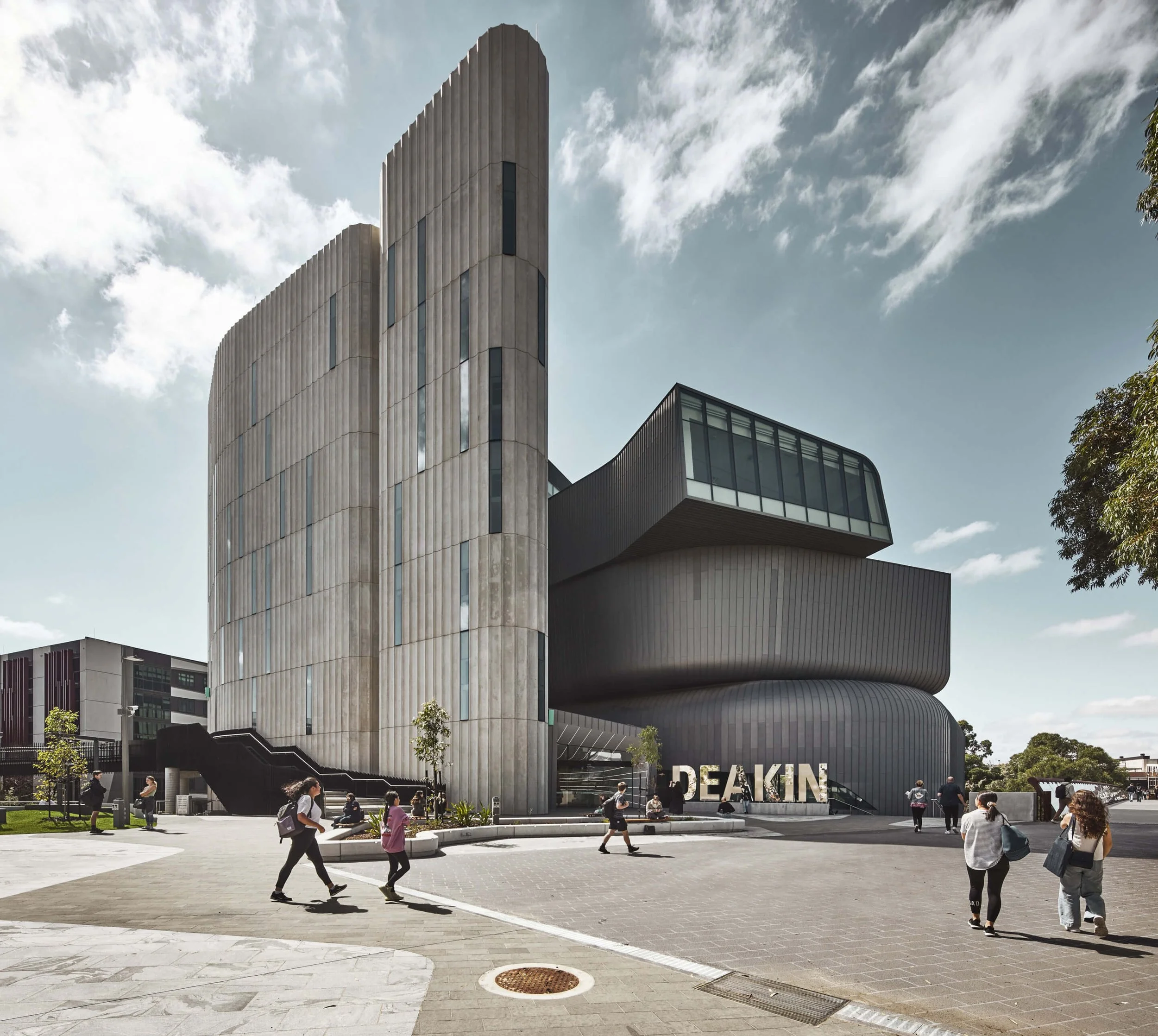 The fluted Deakin Law Building at Deakin University Melbourne Burwood Campus hopes to charm students back to campus