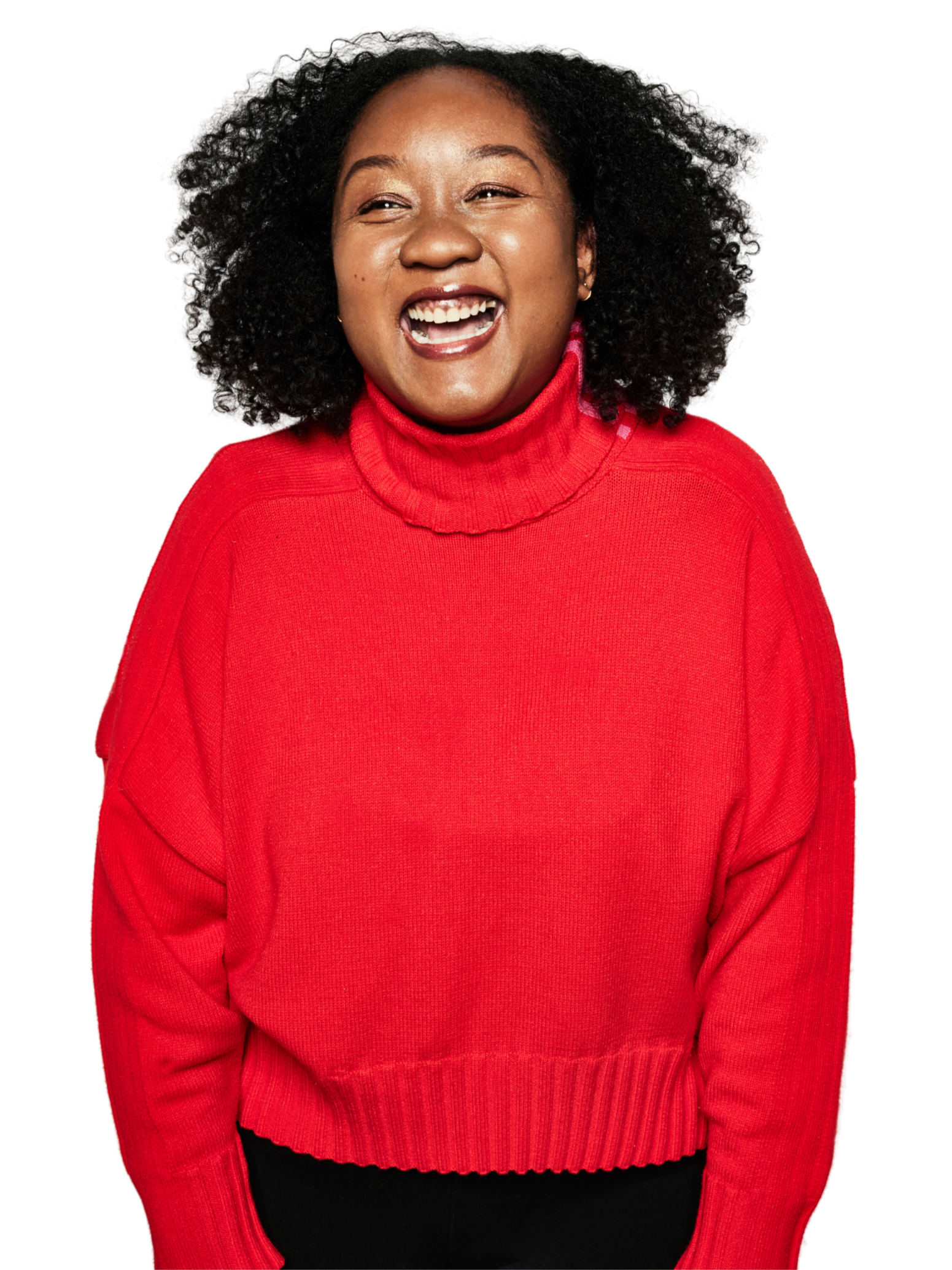 Coko Galore, Toronto actor, comedian and improviser, smiling in a red sweater