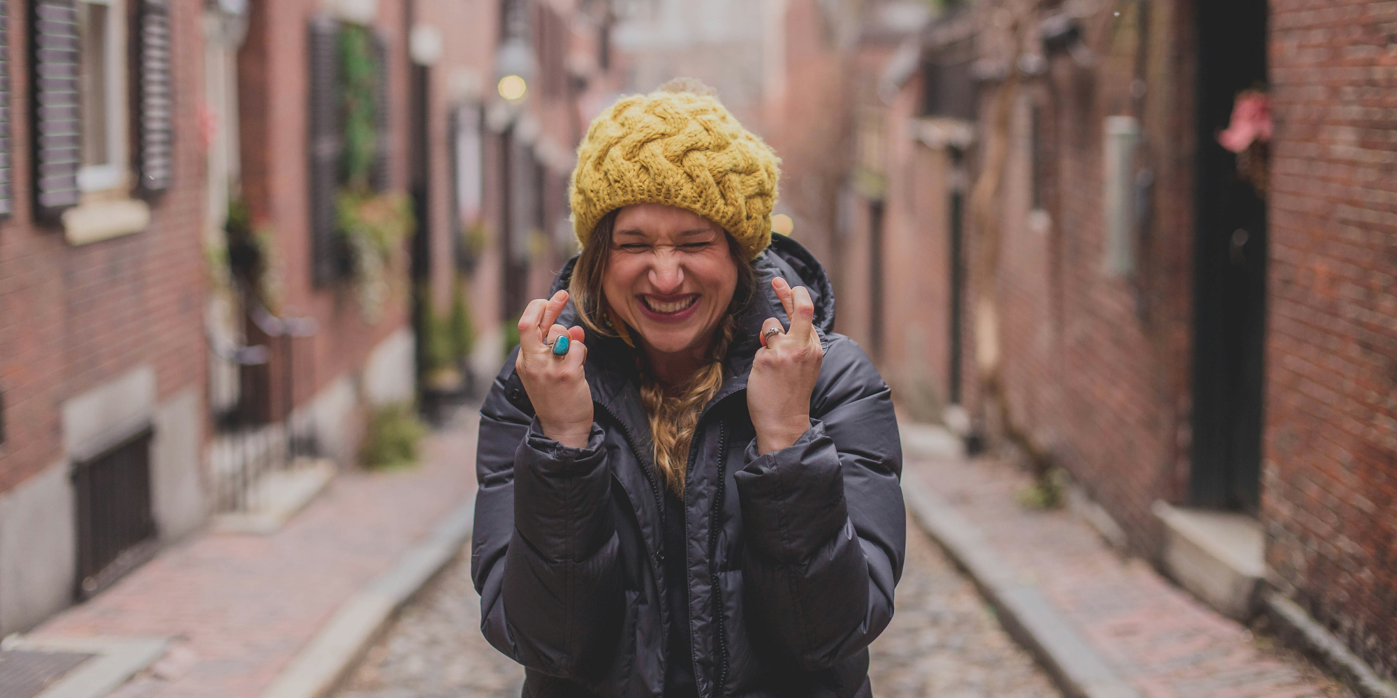 Hopeful woman crossing her fingers