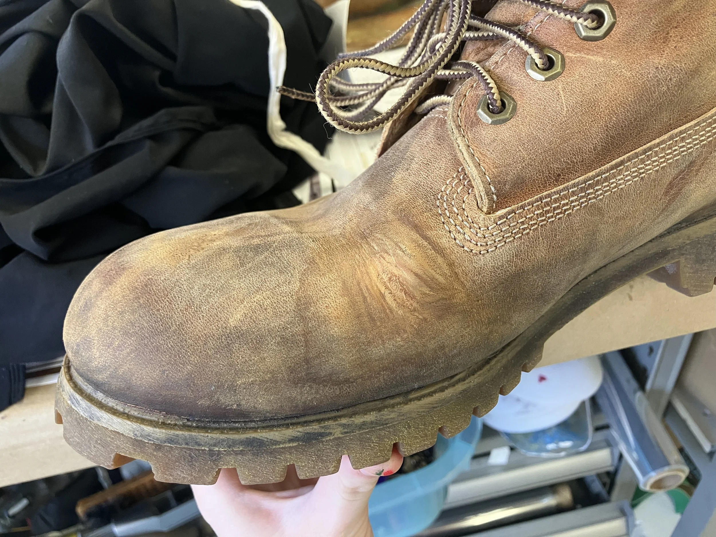 Camouflage painting: covering red stains to restore appearance of distressed leather, "Man of La Mancha" (Northwestern University, '25).