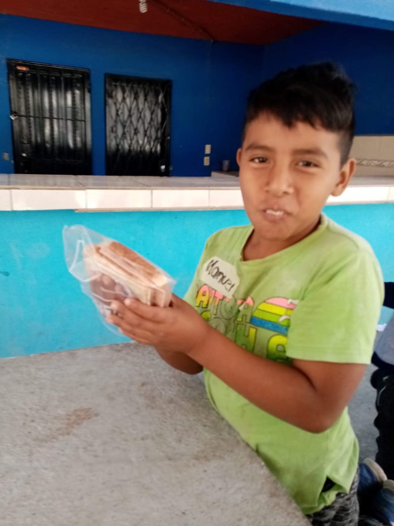 kidHoldingASandwich.jpeg