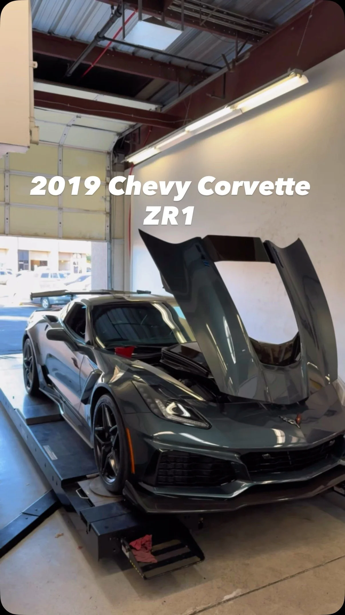 Black 2019 Chevrolet Corvette ZR1 on the shop dyno with its hood open