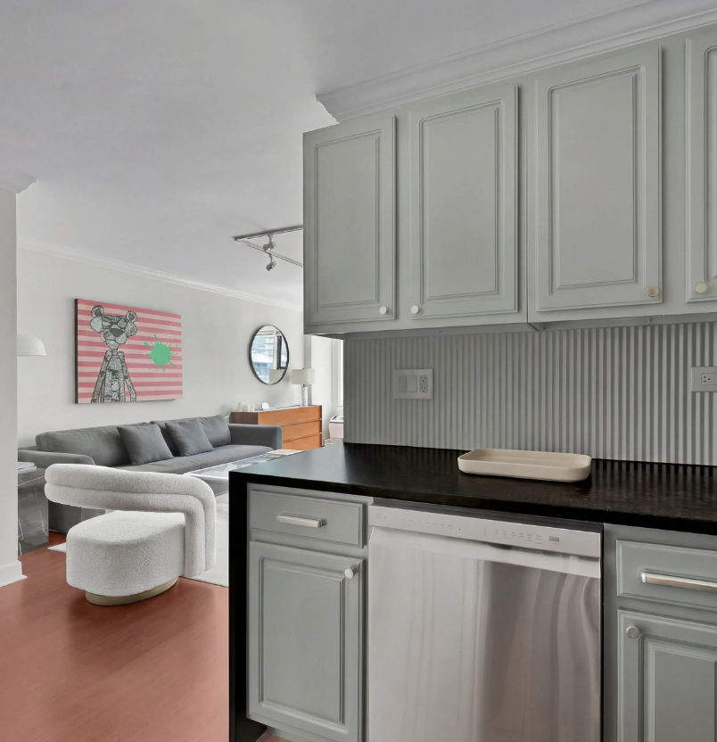 Open-plan Manhattan condo renovation with updated kitchen and living space.