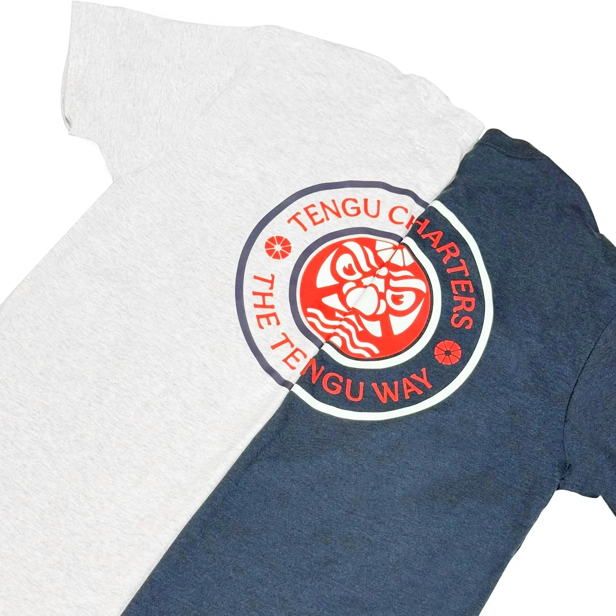 Side-by-side of Tengu Charters fishing shirts in legion blue and heather white for PNW salmon trips