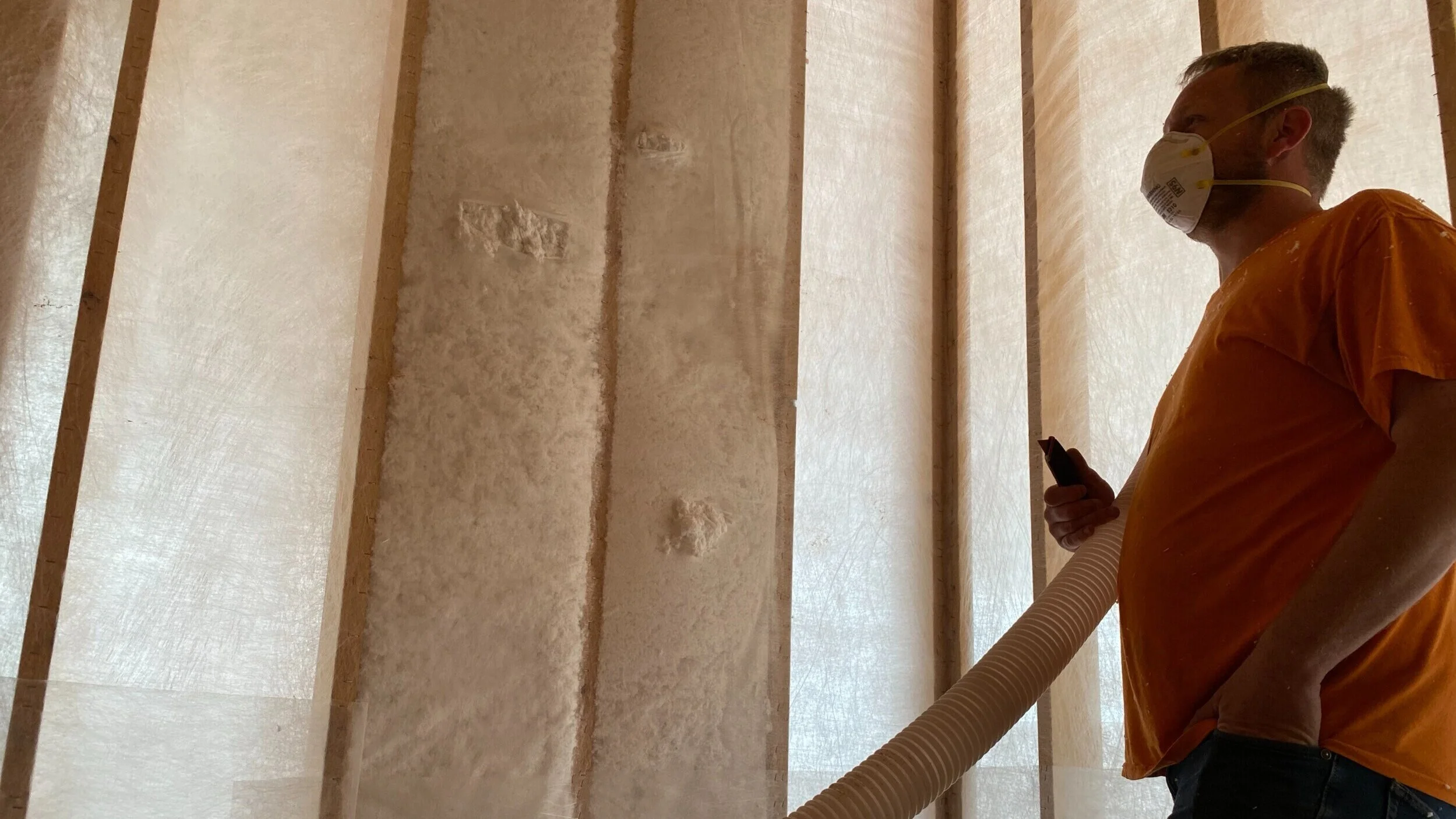 Photograph showcasing the Fiberglass Blown-In Blanket System (BIBS) wall insulation.