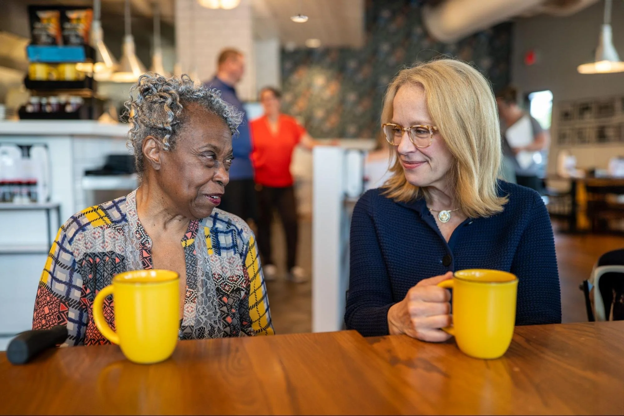 Kelly having coffee with a constituent