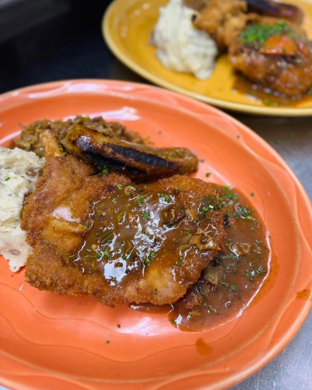 Why pick just one when you can have it all? 🥩🌭 Our Jaegerschnitzel Combo special is here for a limited time!

Includes a breaded, bone-in pork chop, grilled bratwurst, slow roasted sauerkraut, roasted garlic mashed potatoes, hunter gravy, d&uuml;ss