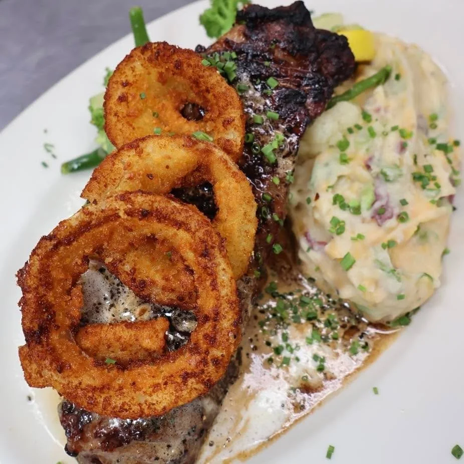 🥩 This is the kind of special you clear your dinner plans for.

A 16oz grilled marinated prime boneless shell steak, roasted garlic mashed potatoes, saut&eacute;ed market vegetables, Irish whiskey compound butter, and crispy onion rings.
