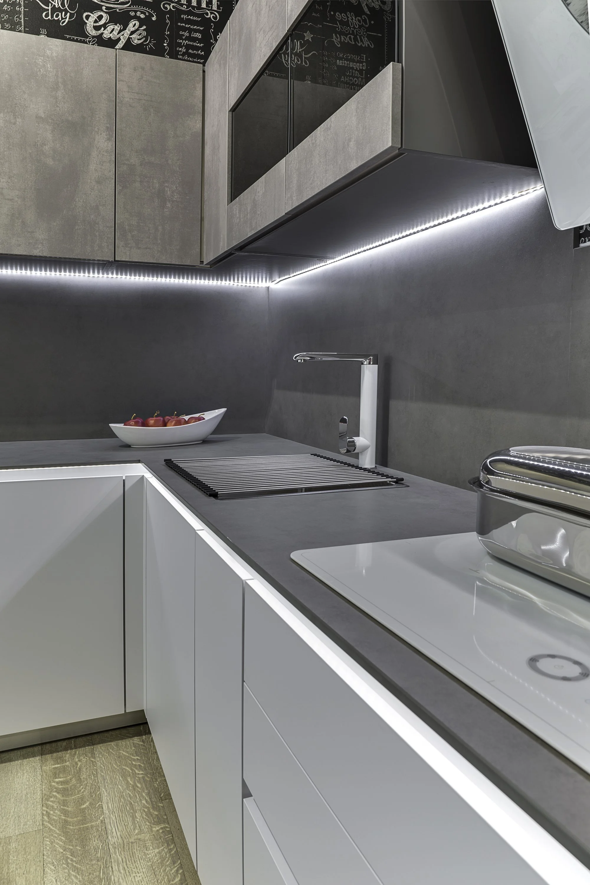Neolith Pietra di Piombo countertops and backsplash with a thin edge profile for a minimalist European aesthetic.