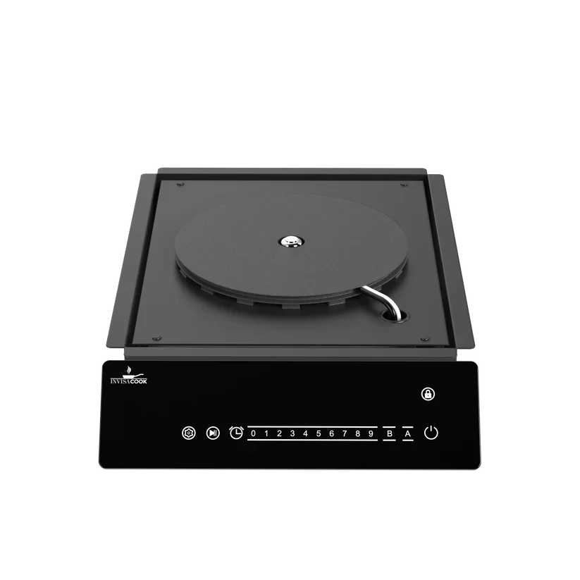 Invisacook single burner system installed under porcelain countertop for compact kitchen cooking design
