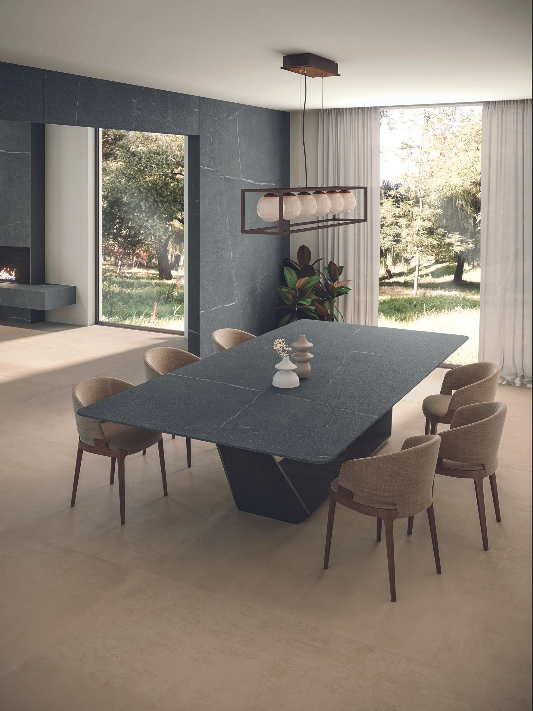 This dining room features an Atlas Plan porcelain slab table, capturing the natural beauty of soapstone with the added durability and practicality of porcelain.