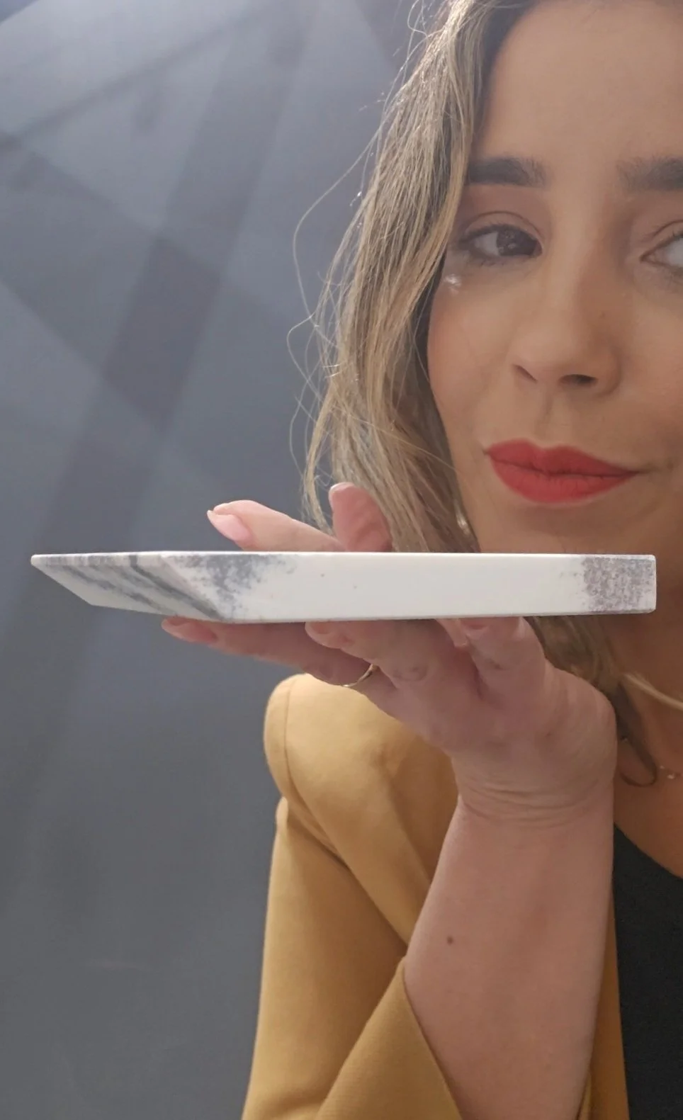 Lais Luz showcasing the minimalist, floating aesthetic of a porcelain slab with a specialized shark nose edge profile, designed for contemporary European kitchens.