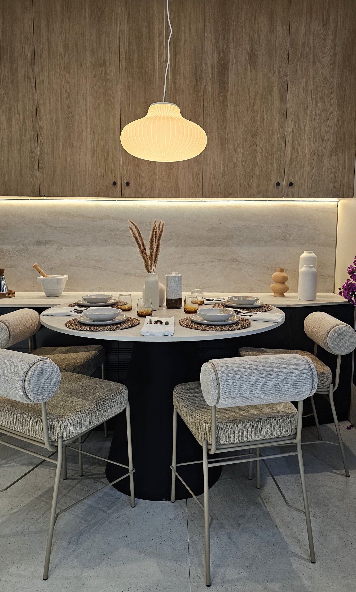 A luxury kitchen surface featuring Dekton Amazonik as a high-performance alternative to natural wood, showing the realistic exotic wood grain texture.