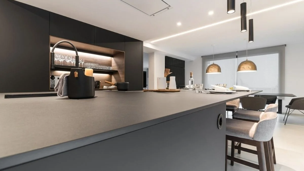Modern luxury kitchen featuring dark Lapitec sintered stone countertops, offering a sleek, silica-free, and heat-resistant surface.