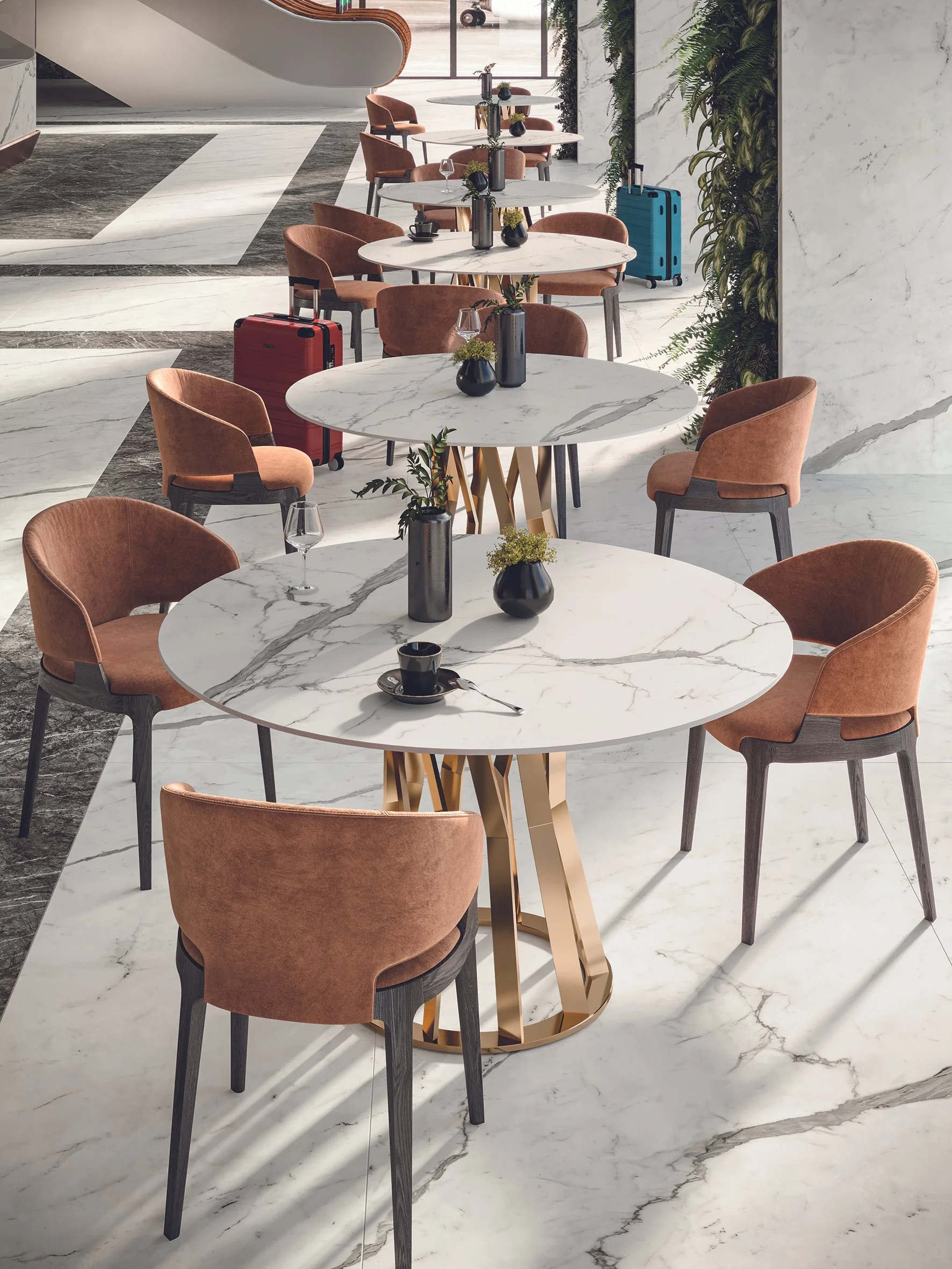 These round porcelain tables, featuring Statuario Supremo, offer a hygienic and stylish dining solution for restaurants.
