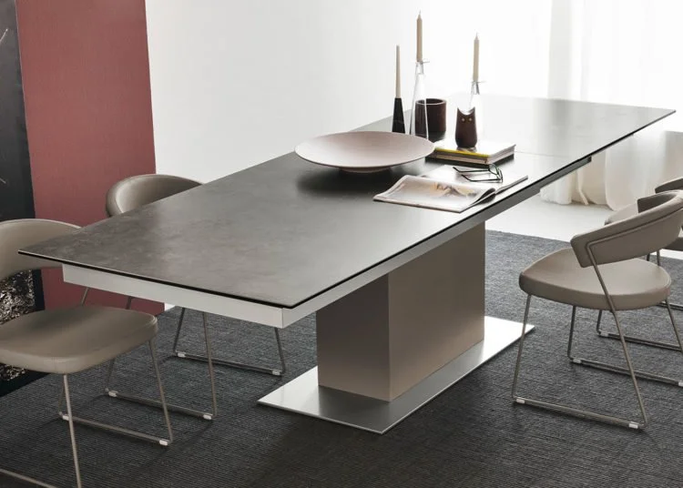 Maximize your space with this extendable Italian porcelain table. It's the perfect solution for flexible dining needs.