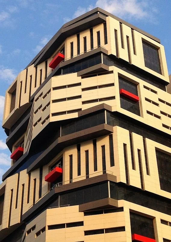 Sustainable modern architecture featuring Neolith mineral surface facade cladding.