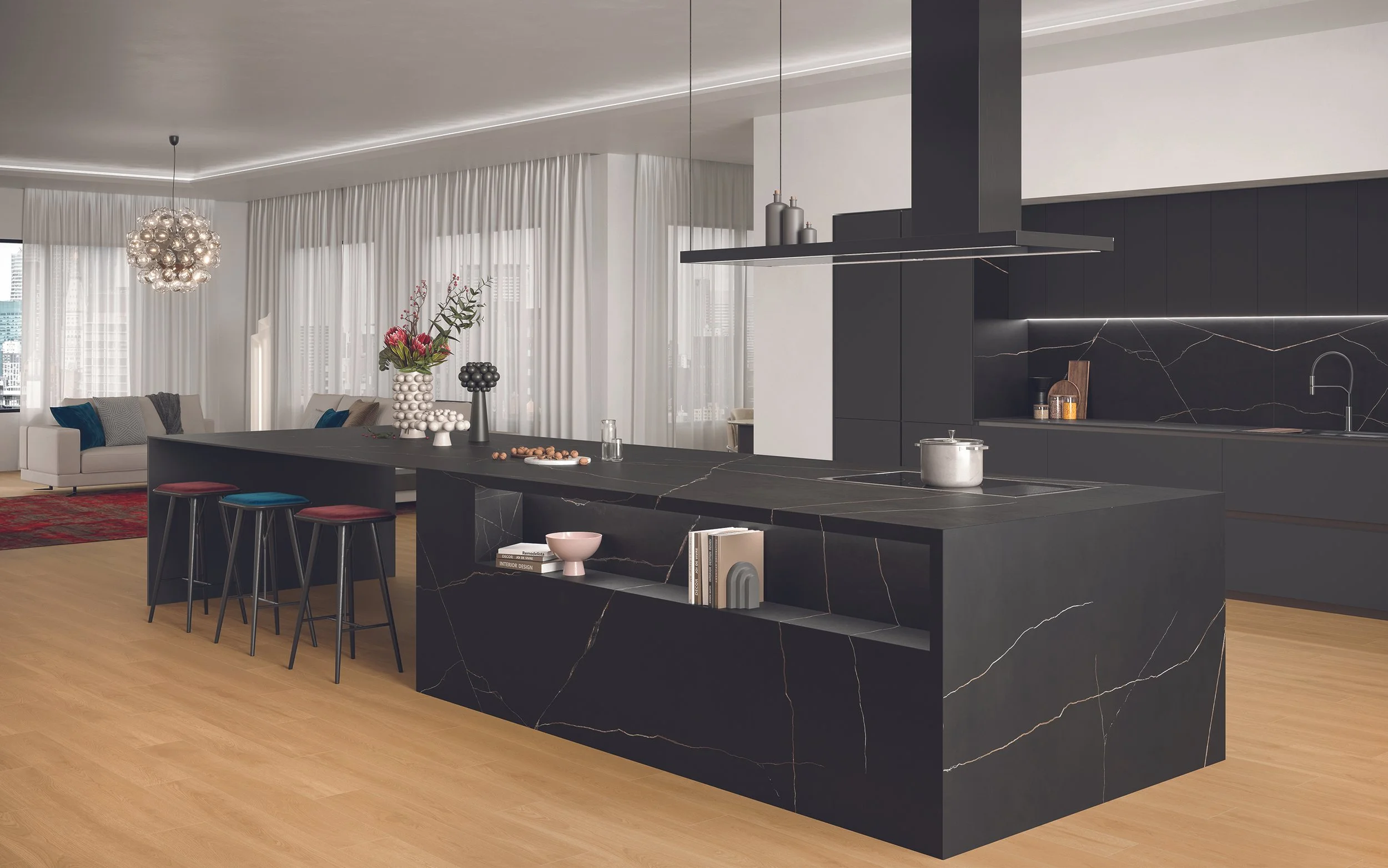 This dramatic kitchen island, featuring Atlas Plan Black Atlantis porcelain, commands attention with its dark, luxurious veining and expansive surface. The integrated seating area provides a stylish gathering spot, while the open shelving adds a touc