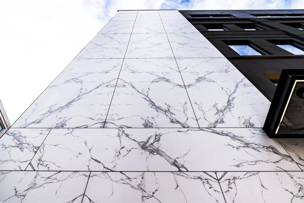 Close-up of a marble effect Dekton facade, showcasing its unique veining and color variation.