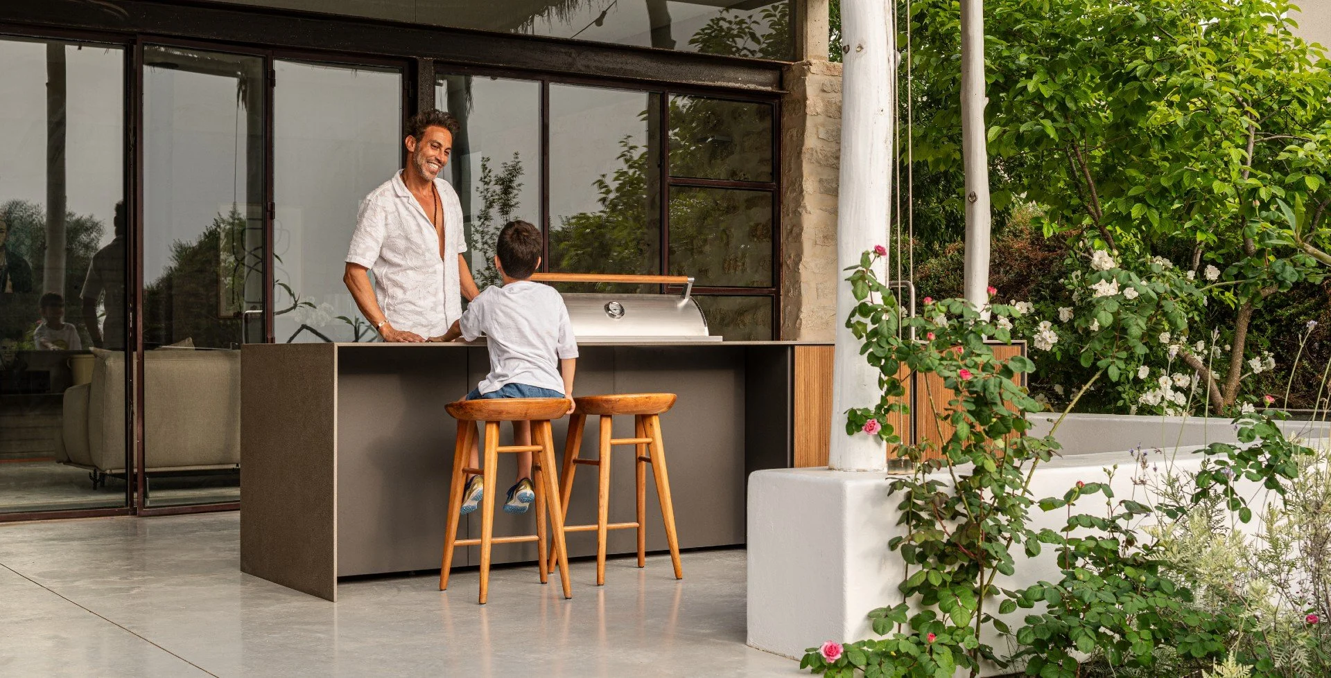 Close-up view of premium Italian outdoor kitchen cabinets with a 15-year weather warranty on a patio in Sarasota.