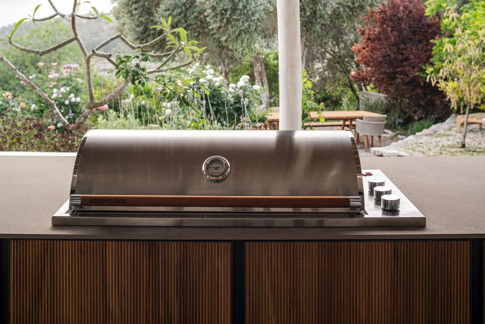 Close-up view of a contemporary Strato outdoor cabinet door showcasing the minimalist integrated aluminum handle profile.