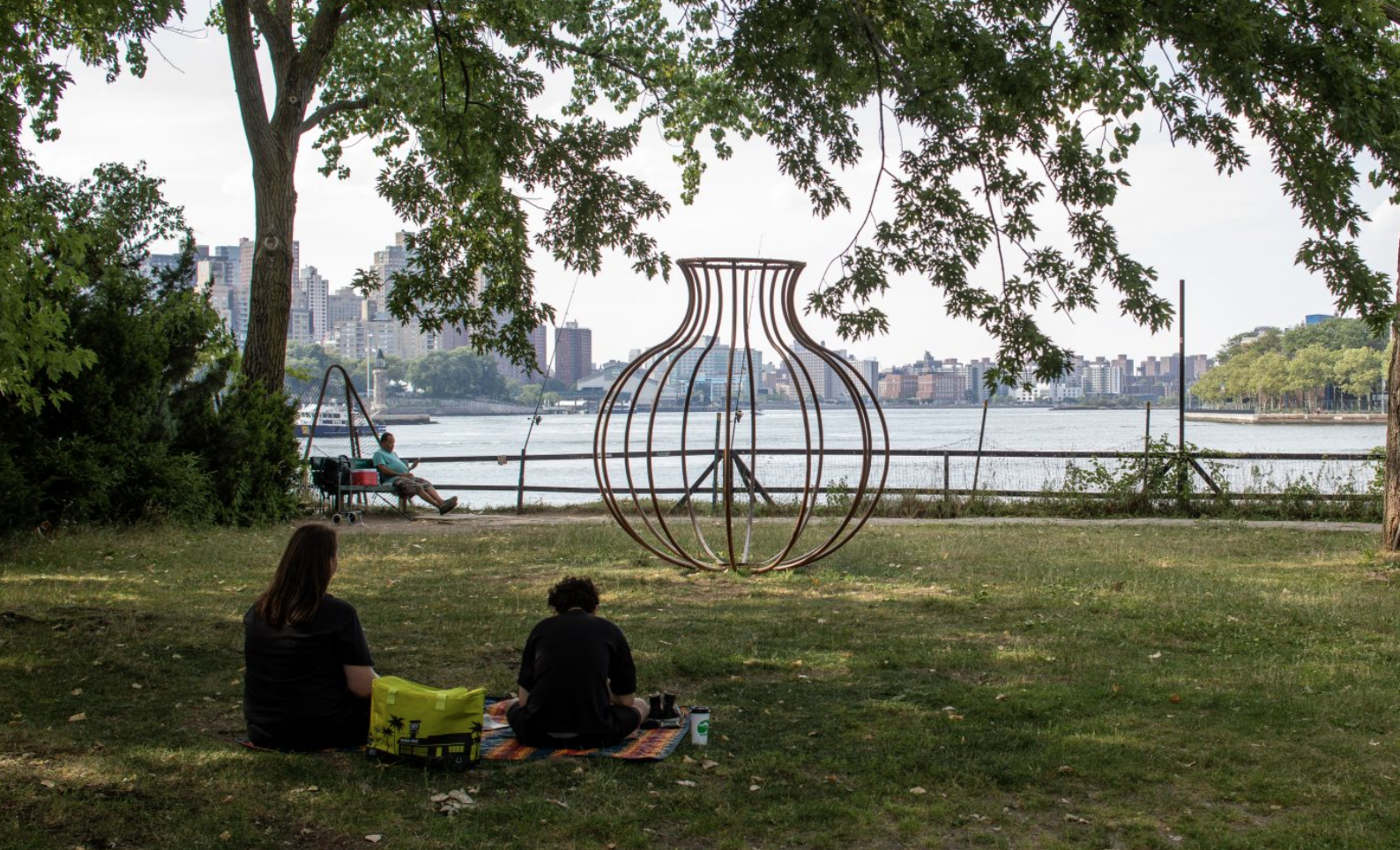 Maren Hassinger's outdoor vase-shaped public artwork Vessel One with river view and picnicers