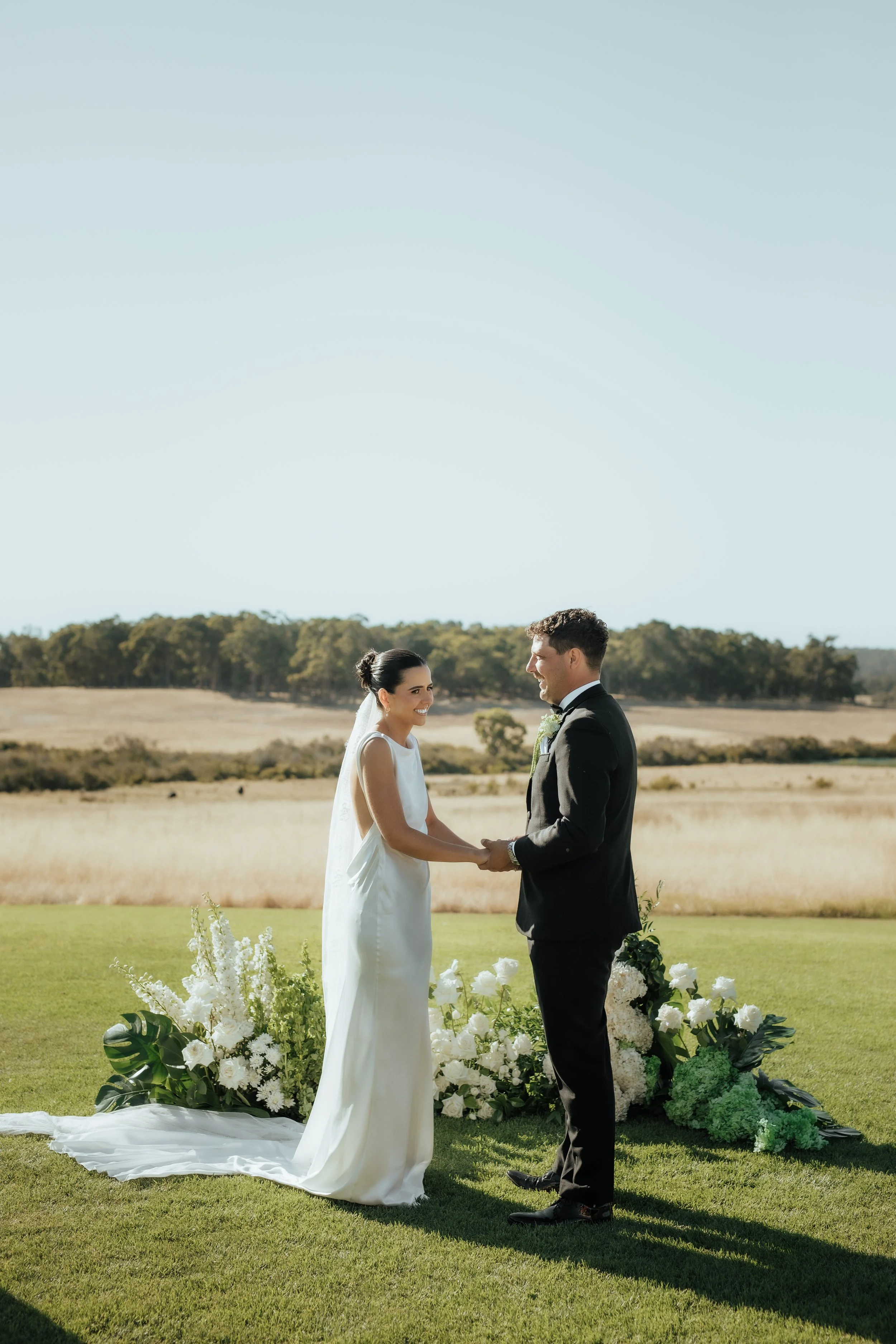 tiller farm ceremony with amazing greens and whites and blacks