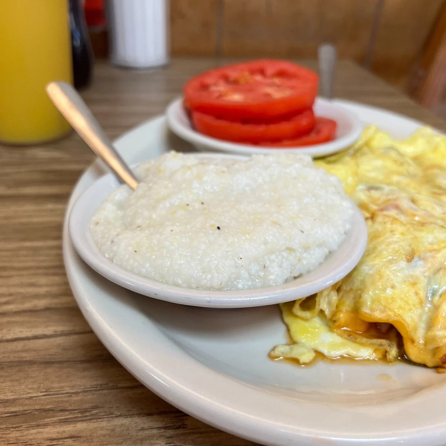 Creamy grits are like a soft southern drawl for your taste buds.

#bigbreakfast #nashvillebreakfast #countryham #scrambledeggs #omelette #grits #biscuitandgravy #gravybiscuit #eggsovereasy #sunnysideupeggs #bacon #baconlover #sausage #hotcoffee #nash