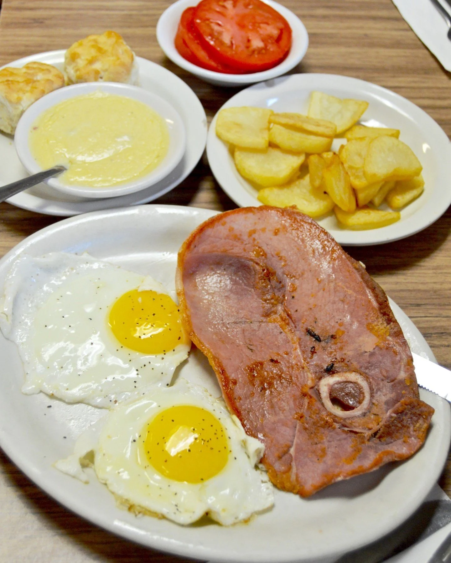 You know you're getting older when a country ham breakfast gets you more excited than a Friday night. Two eggs, biscuits, and country ham? That's what my granddaddy would've called "startin' the day with a full tank."

#bigbreakfast #countr