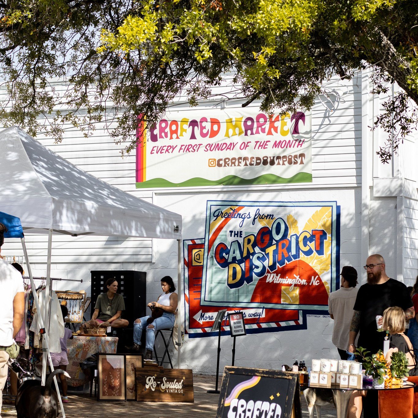 What the sign says 👆 It&rsquo;s @craftedoutpost MARKET DAY! 🥳 From 12pm-4pm, the @cargodistrictcourtyard will be filled with more than 20 local vendors for you to explore while sipping on a drink from @olio_courtyardbar. 🍻 If you come hungry, don&